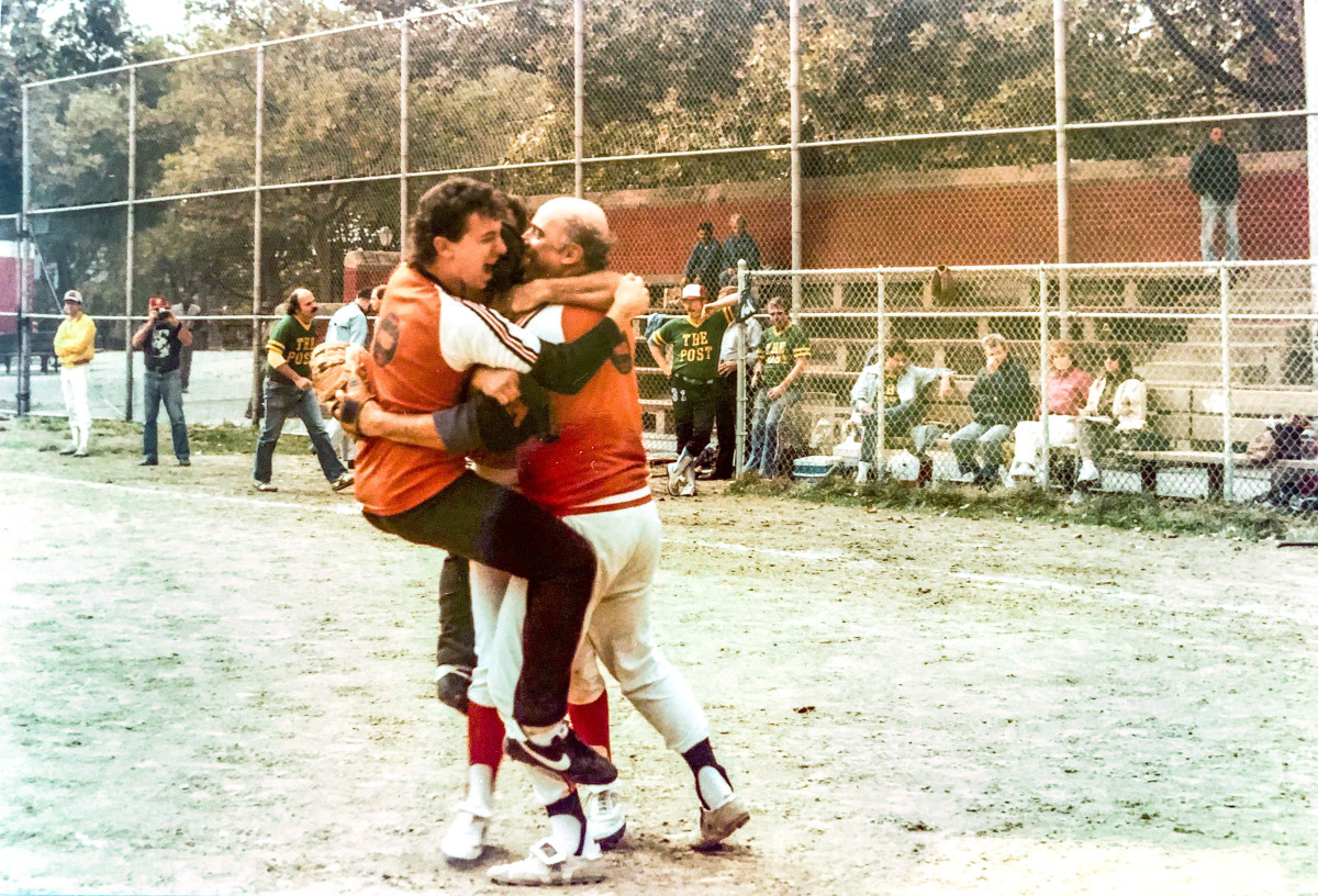 McMane (right) and UPI teammate Joel Sherman celebrate winning the 1984 title over the Post (for whom Sherman is now a baseball columnist) at the league's alternate field on 54th St. and 11th Ave.